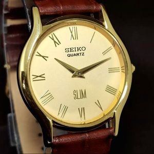 SEIKO slim MENS WATCH Quart GOLD Roman Numerals on Gold Dial. Works Great.